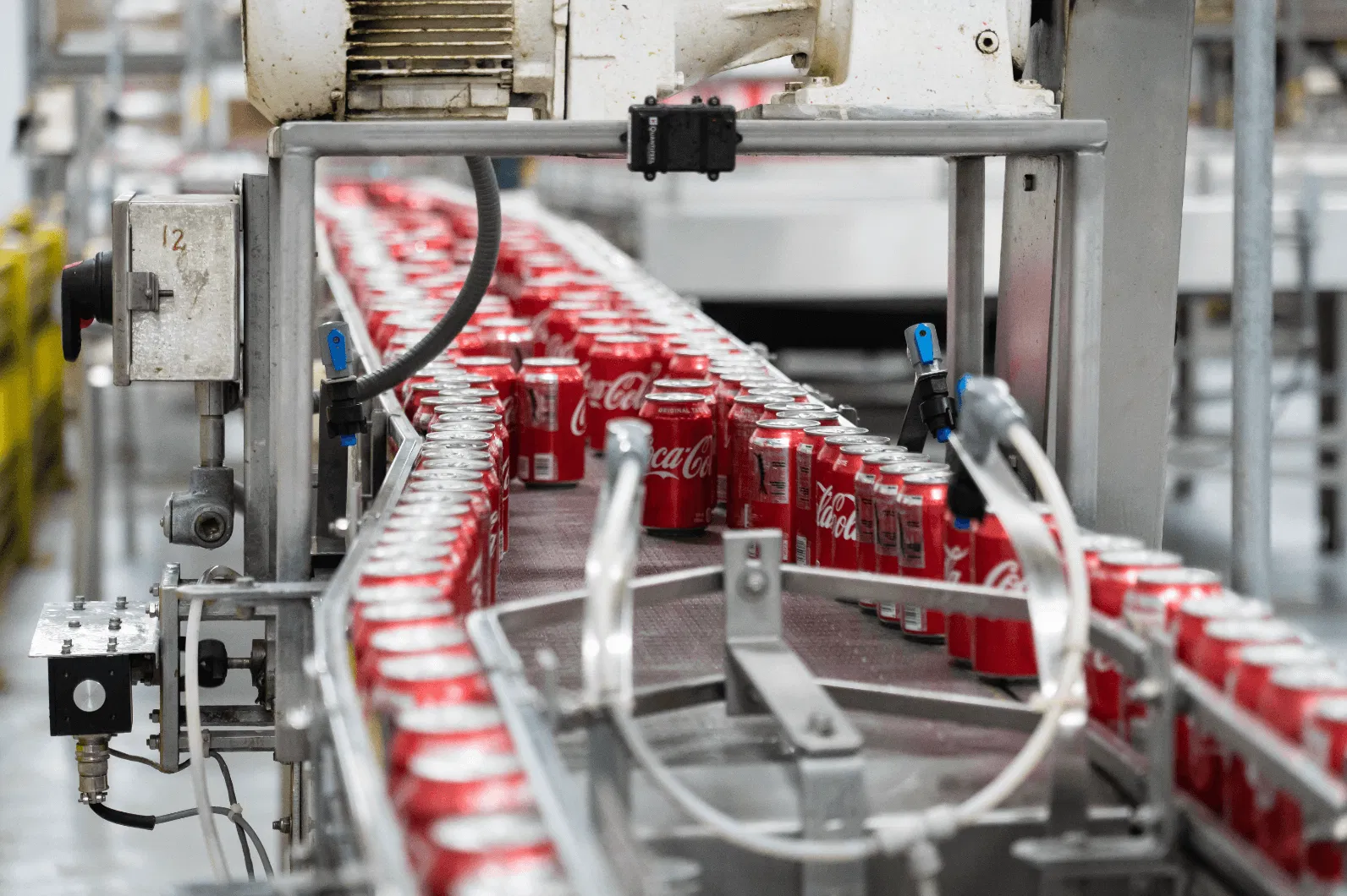 Bottle conveyor, filled with Coca-Cola's aluminium bottles