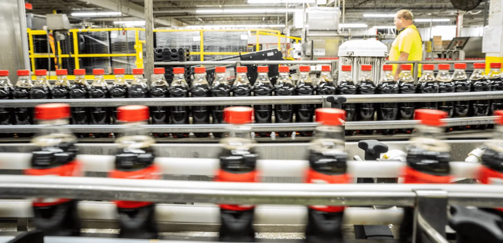 Bottle conveyor, filled with Coca-Cola's plastic bottles
