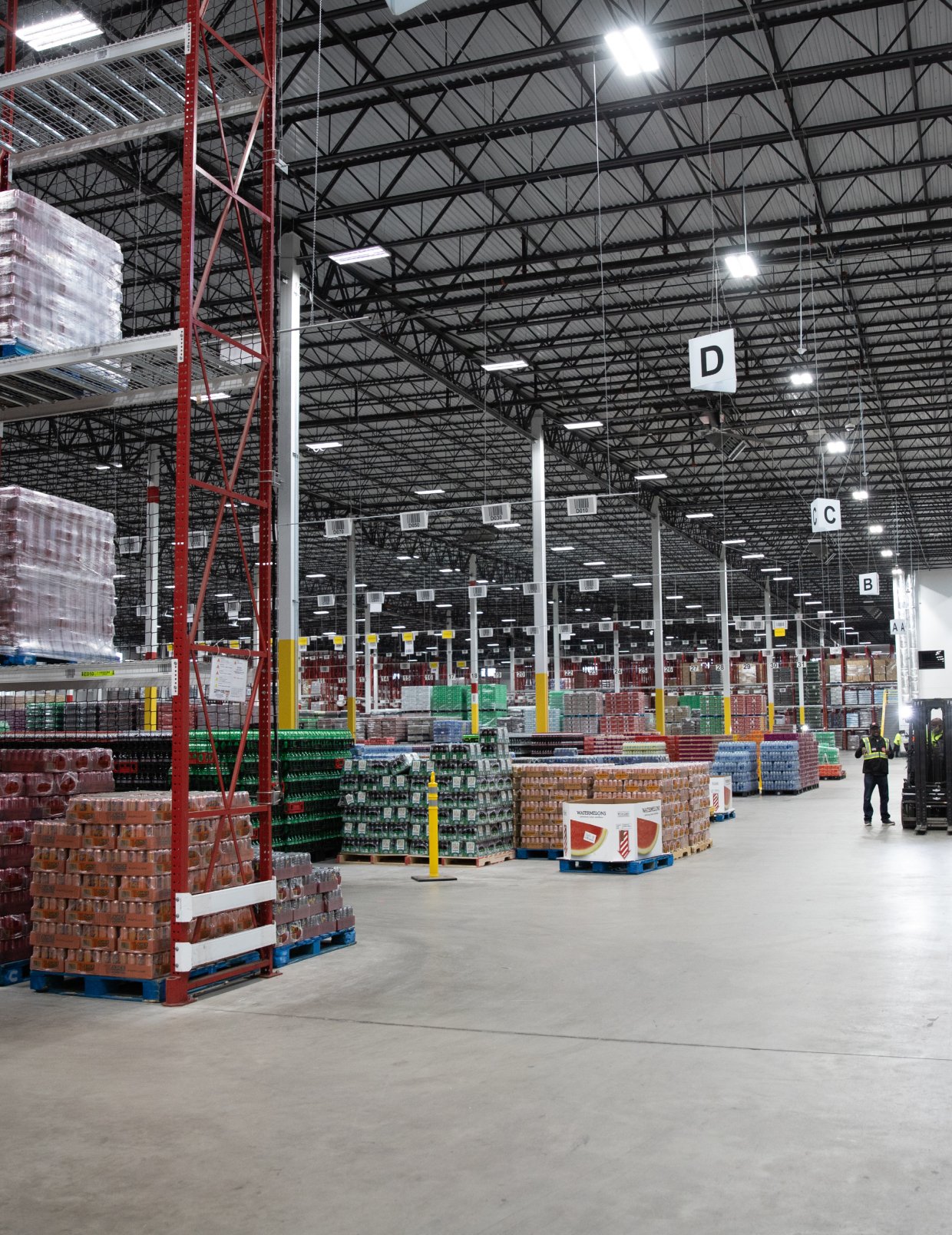 Indoor warehouse with high ceilings, filled with pallets of RCCB products